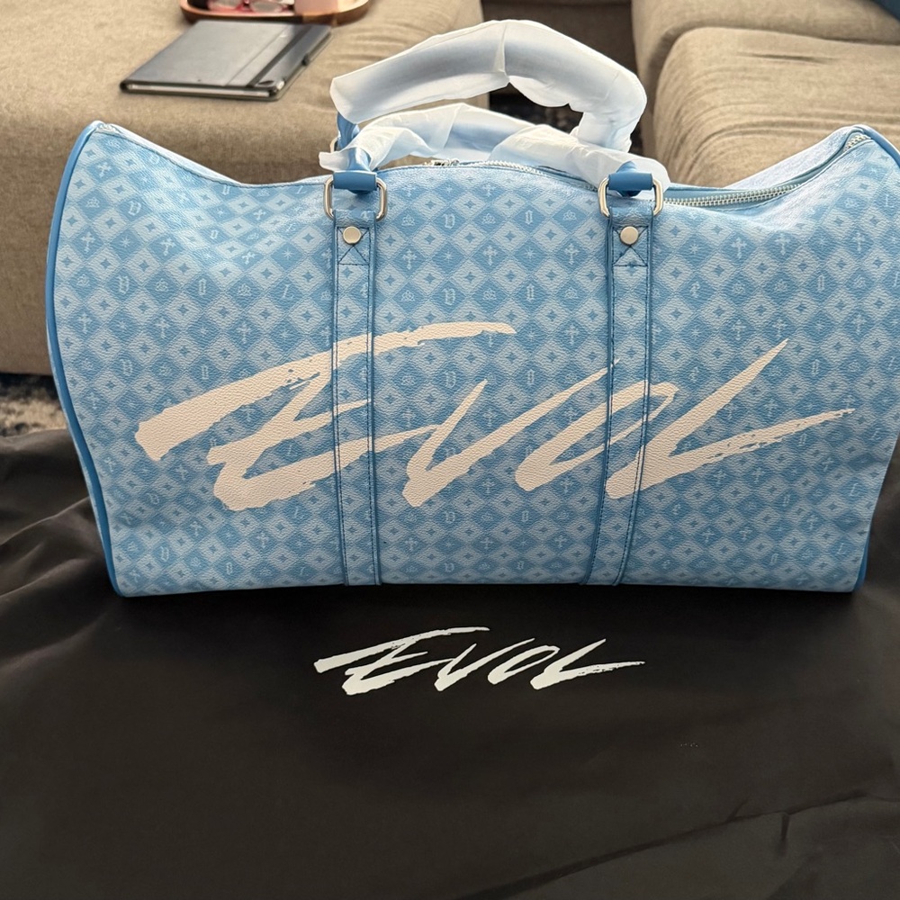 Light Blue Graphic Travel Duffel Bag with White Script Accent